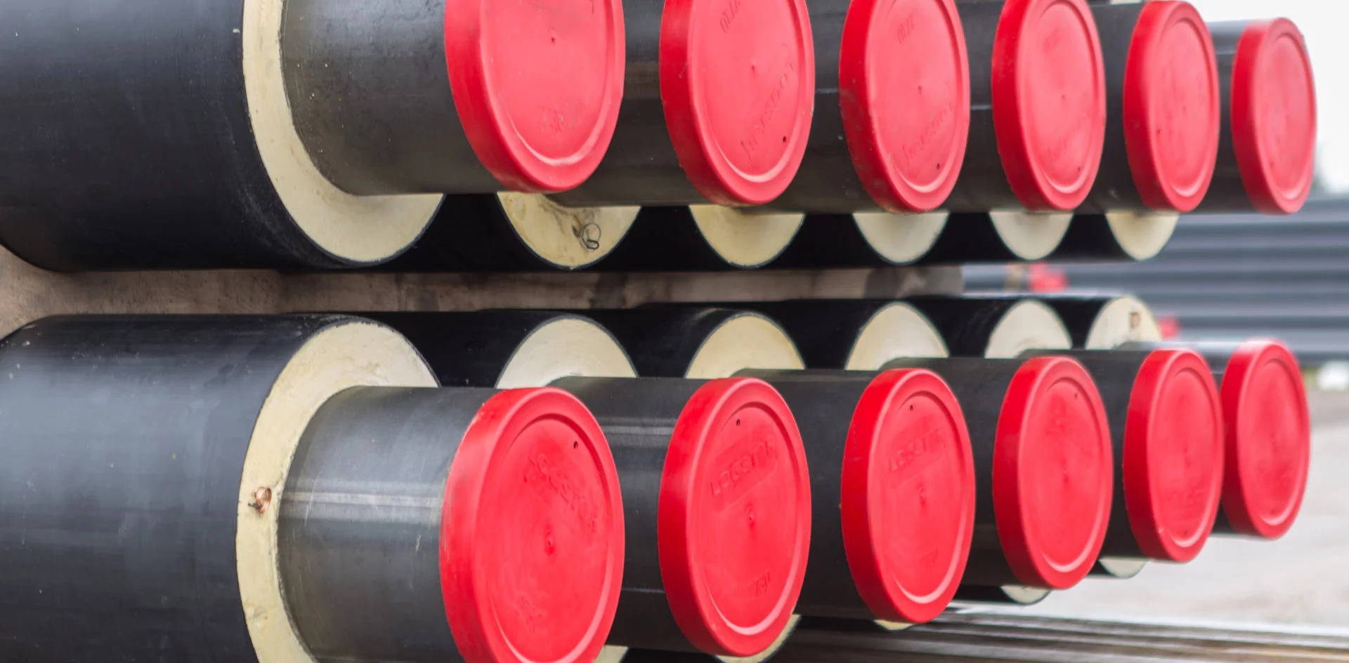 Man Using Measuring Tape in Factory Setting Man Using Measuring Tape in Factory Setting